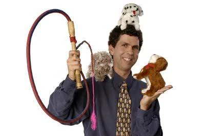 Daniel Holzman performing with juggling props