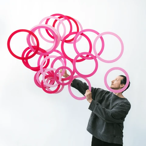 Jay Gilligan performing with juggling rings