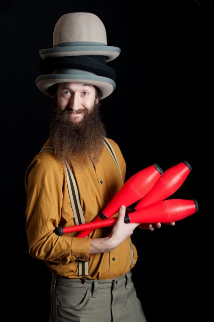 Will Oltman holding juggling clubs